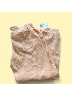 Rip Curl peachy cotton beach pants with front and back pockets.